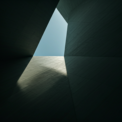 Harsh midday Indian sunlight casting deep geometric shadows across a modern concrete building — the climate HARLAND was formulated for.